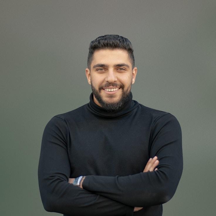 Ava Singh, Lead Design Curator at Green Mountain Collective, reviewing corporate floral arrangements